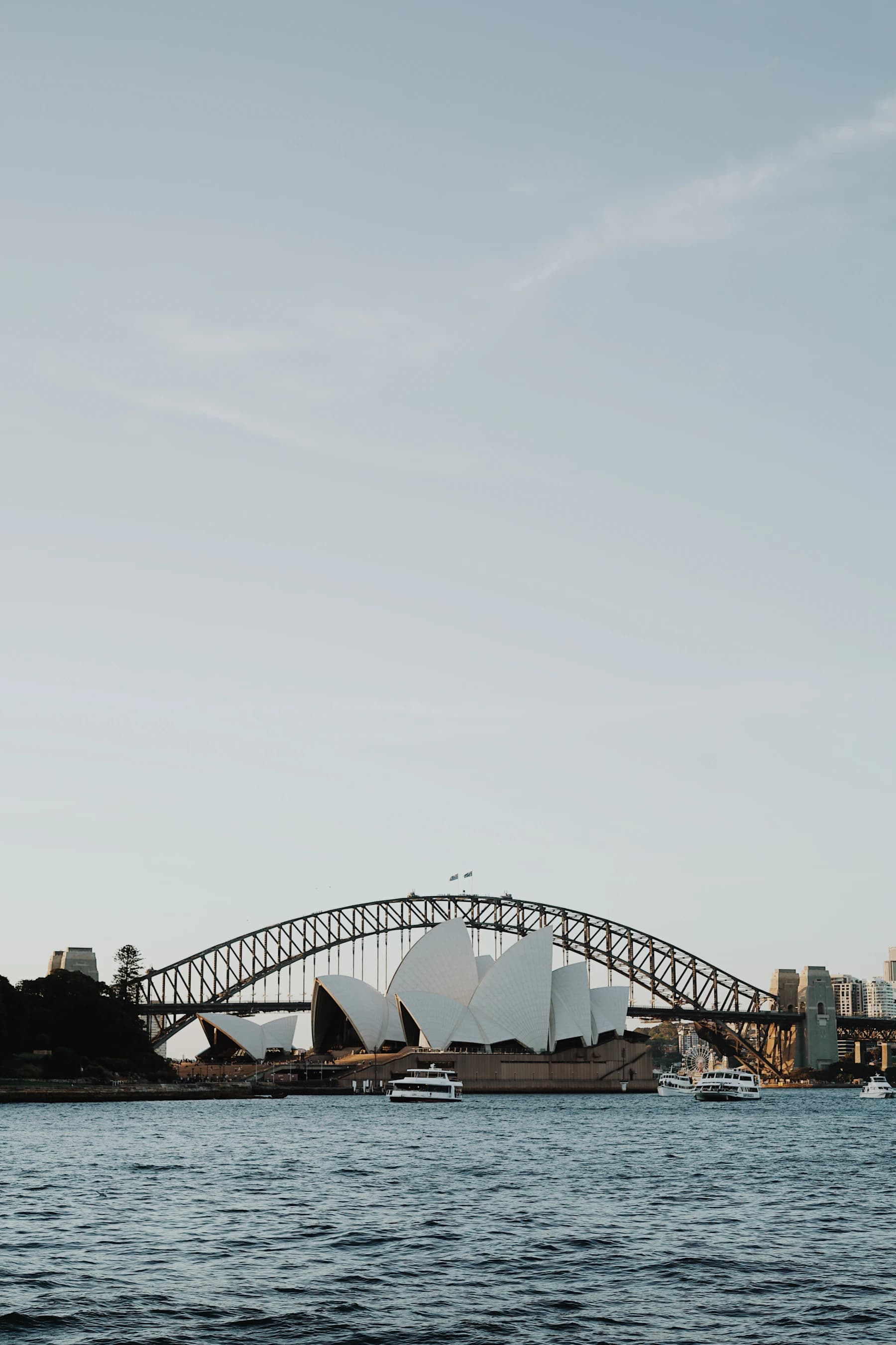 Sydney Opera House and the Harbour Bridge beside Sydney Harbour